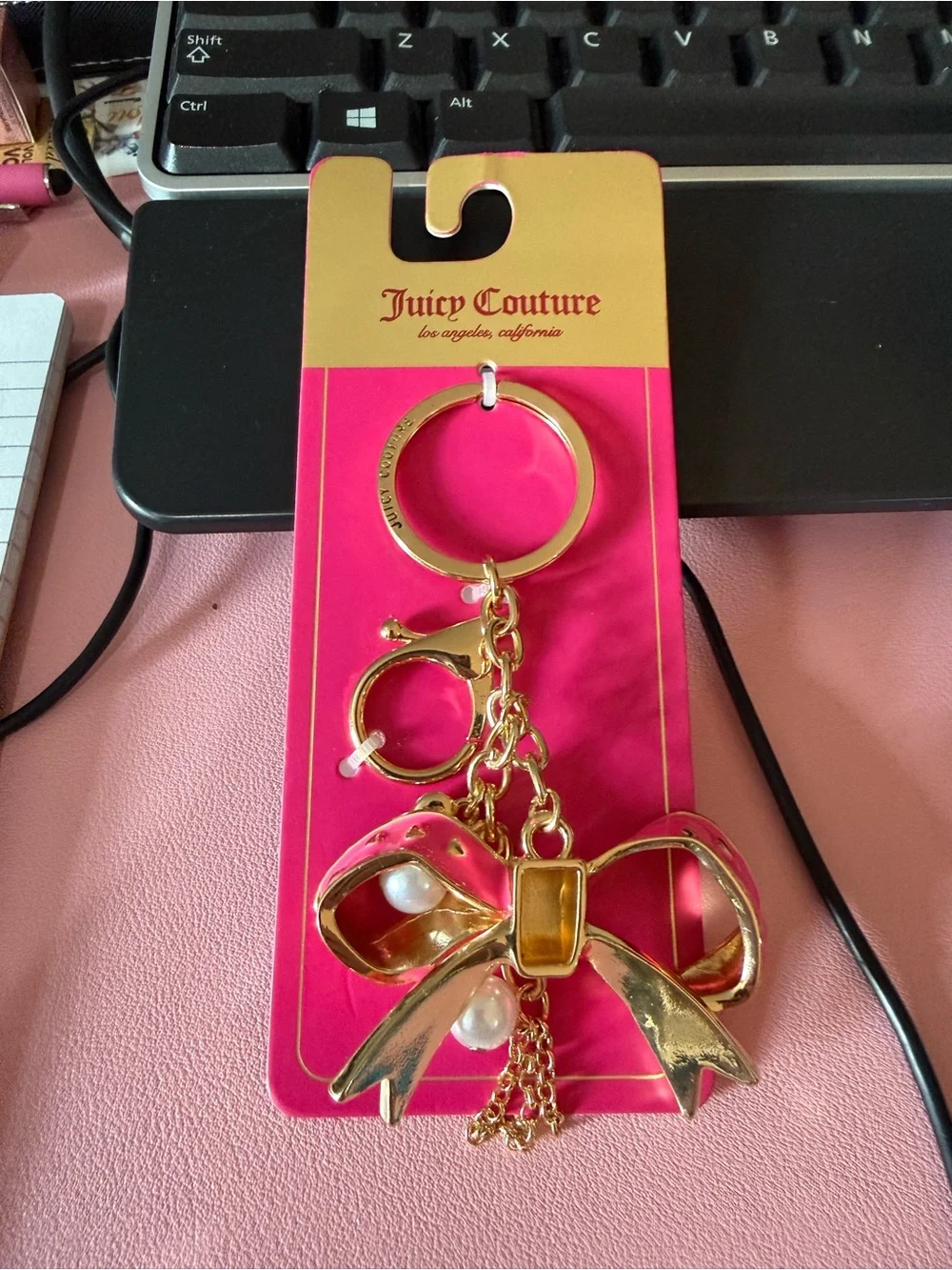 Juicy Couture Gold-Tone Bow Keychain with Pink Card Holder Backing